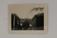 FOUND PHOTO Woman In Dress Between Two Houses Snapshot Vtg Photo 1940s