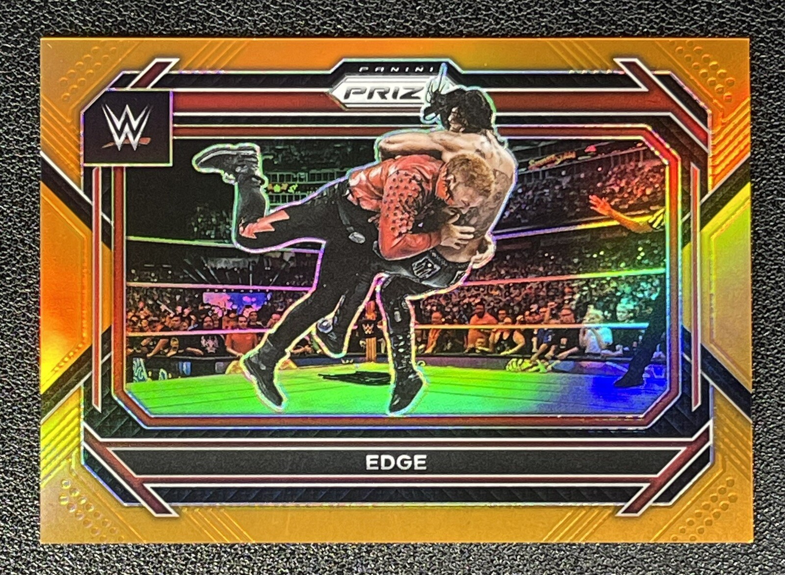 2023 Panini Prizm WWE EDGE #100 Orange Prizm 61 /99 - SP WWE RAW HALL OF FAMER