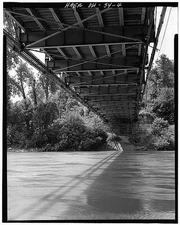 4. VIEW OF UNDERSIDE OF BRIDGE, SHOWING LOWER CHORDS, DECK BEAMS, STRINGERS AND