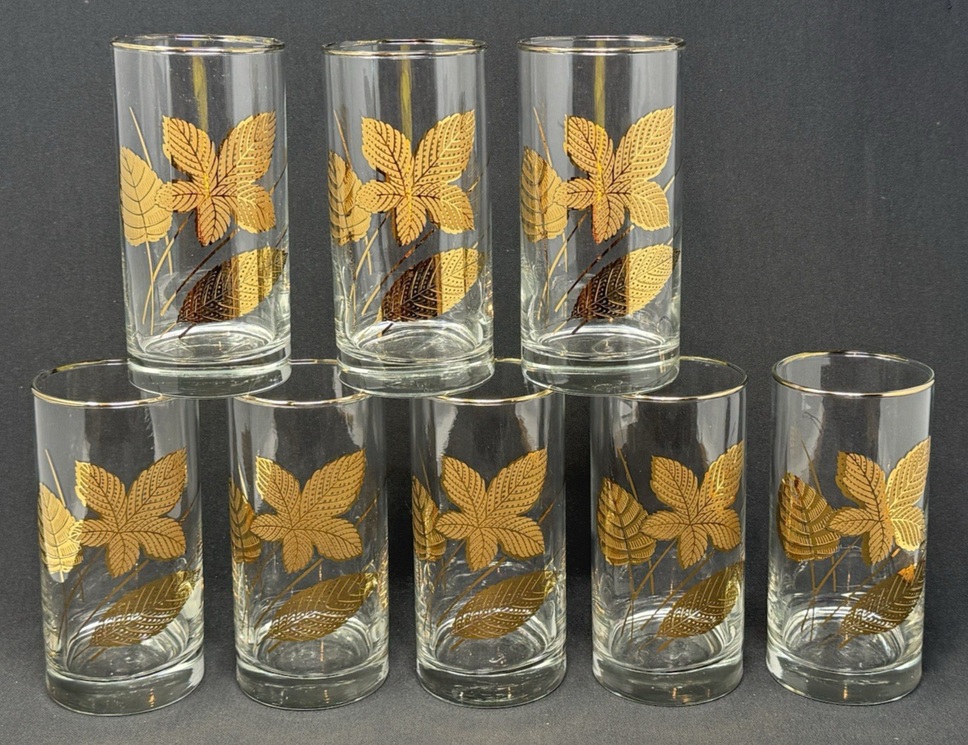 Set of eight highball tumbler glasses with gold rim and gold leaf design