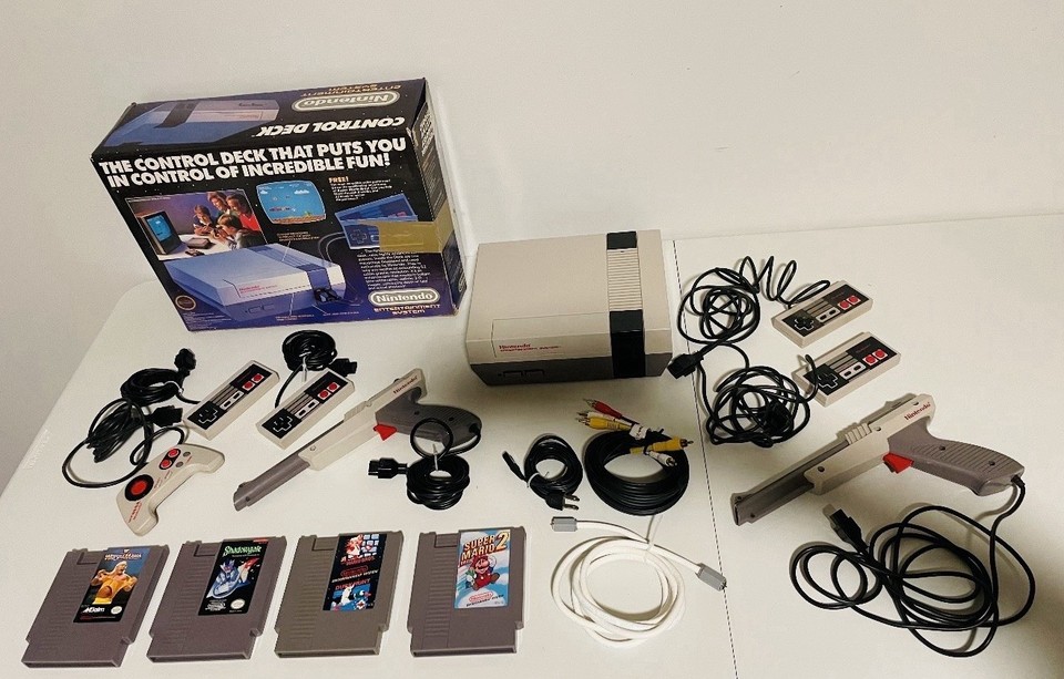 Original 1985 NES Control Deck with its box — the launch-era console that literally saved the video game industry, still intact.