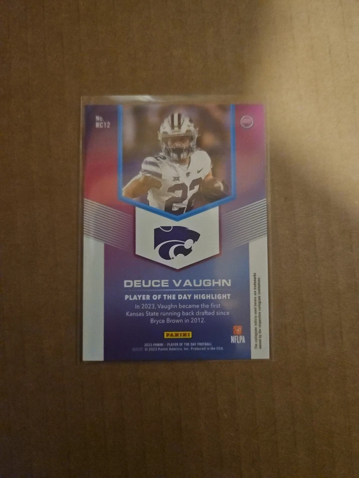2023 Panini Player of the Day Rookie Orange #RC12 Deuce Vaughn RC #22/199 - Image 2 of 2