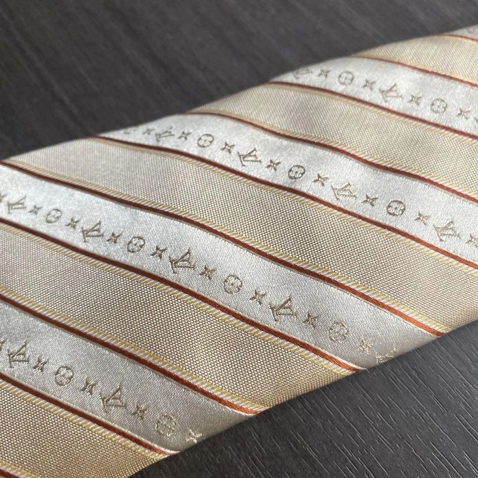 Corbata Louis Vuitton patrón a rayas LV auténtica seda dorada Foto 2 de 4