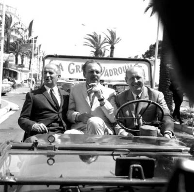 Louis de Funes, Terry Thomas and Andre Bourvil in a jeep on the cr- Old Photo