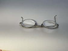 Vintage round wire rim eyeglasses with a classic antique design.