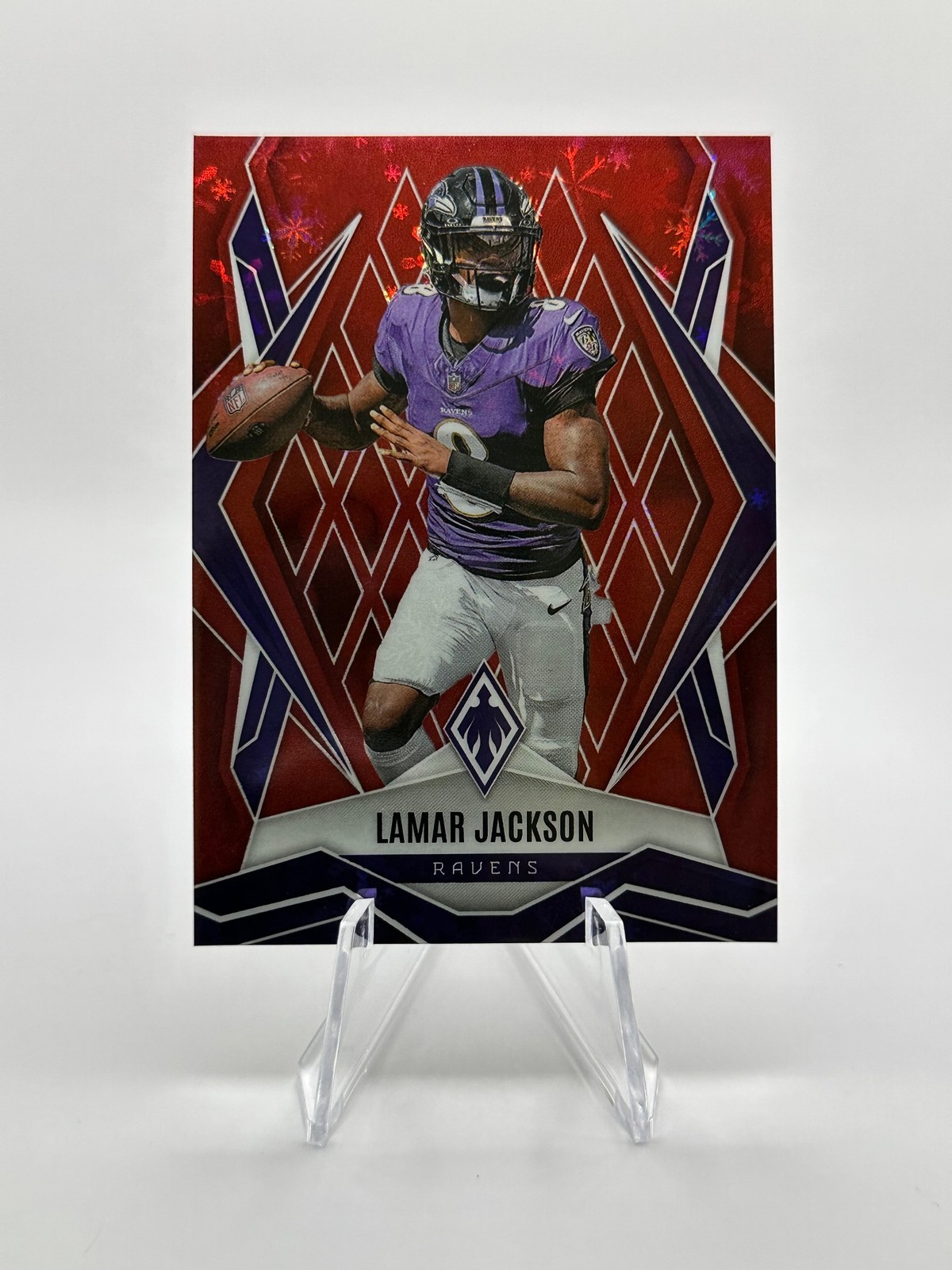 2025 Panini Phoenix #144 Lamar Jackson Red Winter Prizm #/399