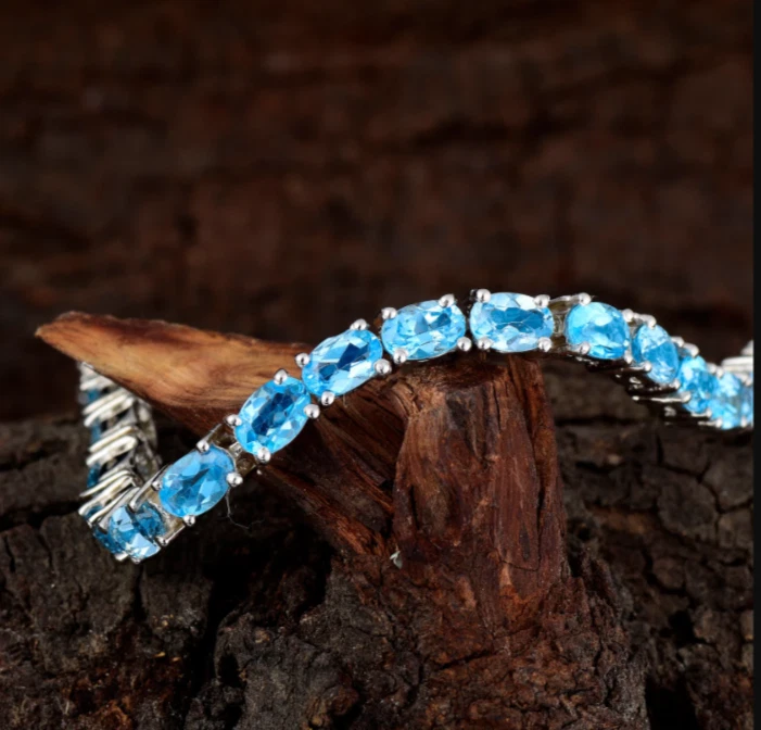 Brazalete de tenis Swiss Blue Topacio ovalado 6*4 platino sobre plata de ley 925 7 pulgadas Foto 3 de 3