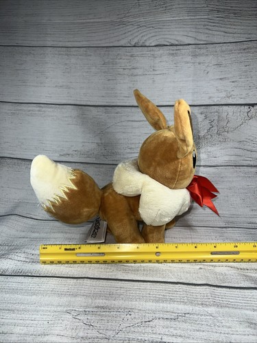 Pokemon Holiday 8" Plush Eevee Stuffed Animal Toy with Red Ribbon Bow - Picture 3 of 13