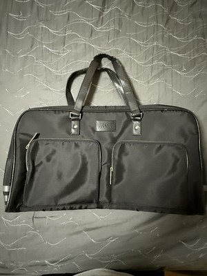 Black Versace Parfums weekend duffle bag features dual front pockets. 