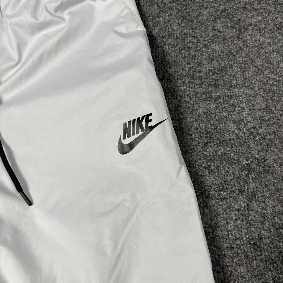 Pantalones Nike Para Hombre Medianos Plateados Reflectantes Joggers Forrados Cremallera Bolsillos Cordón Foto 2 de 4