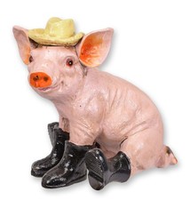 Une figurine en fonte représentant un cochon botté réplique design rétro décorat