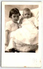 Postcard RPPC Little Girl with Short Hair & Bangs with Baby UNP c1904-1918