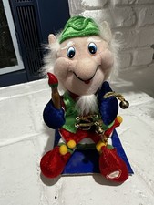 Vintage New Still Attached To Packaging Christmas Elf Plus Santa Moves Sings