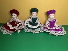 3 miniature porcelain doll lot, Frilly Dresses In Pink,Red, Green, Movable Limbs