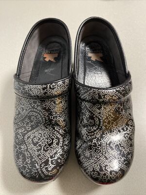 Dansko Professional Metallic Black And Silver Motif Patent Clogs  