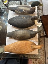 4 Antique  Primitive large carved wooden Duck decoy. Approximately 18 Inches.