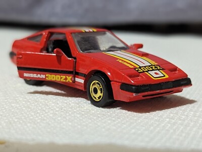 SLEEK NISSAN 300 ZX CAJUN SPICE RED/SUN YELLOW DOORS OPEN 1:64