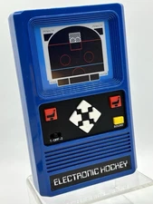 Mattel Basic Fun Retro Handheld Electronic Hockey Game Tested & in VG Cond._