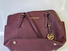 Borsa a tracolla Michael Kors Jet Set pelle saffiano bordeaux zip top tote charm