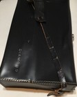 Black leather shoulder bag with visible stitching and a white “Diamond” label on the front panel.