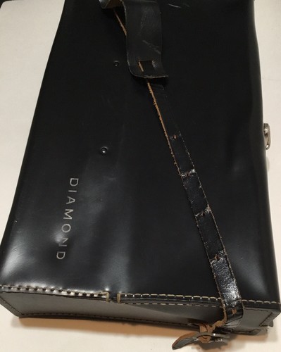 Black leather shoulder bag with visible stitching and a white “Diamond” label on the front panel.