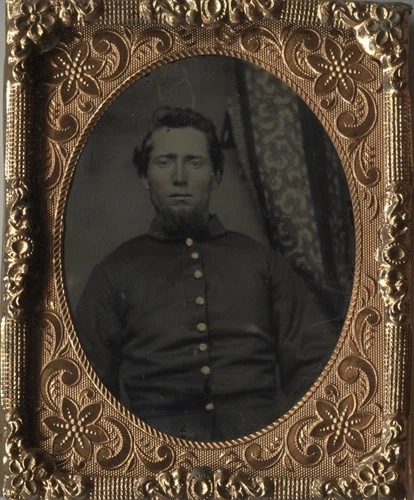 Cased 9th plate ruby ambrotype of an unidentified Union private wearing a frock