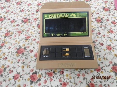 TOMY Caveman 80s Handheld Game TABLETOP