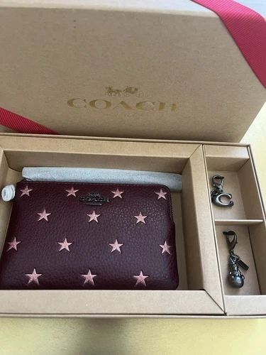 Bracciale Coach Merlot colore con stelle glitter con 2 ciondoli in scatola