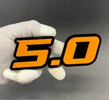 Set of (2) 5.0 Car Emblem Badges Racing Aggressive Orange on Black Fender Badges