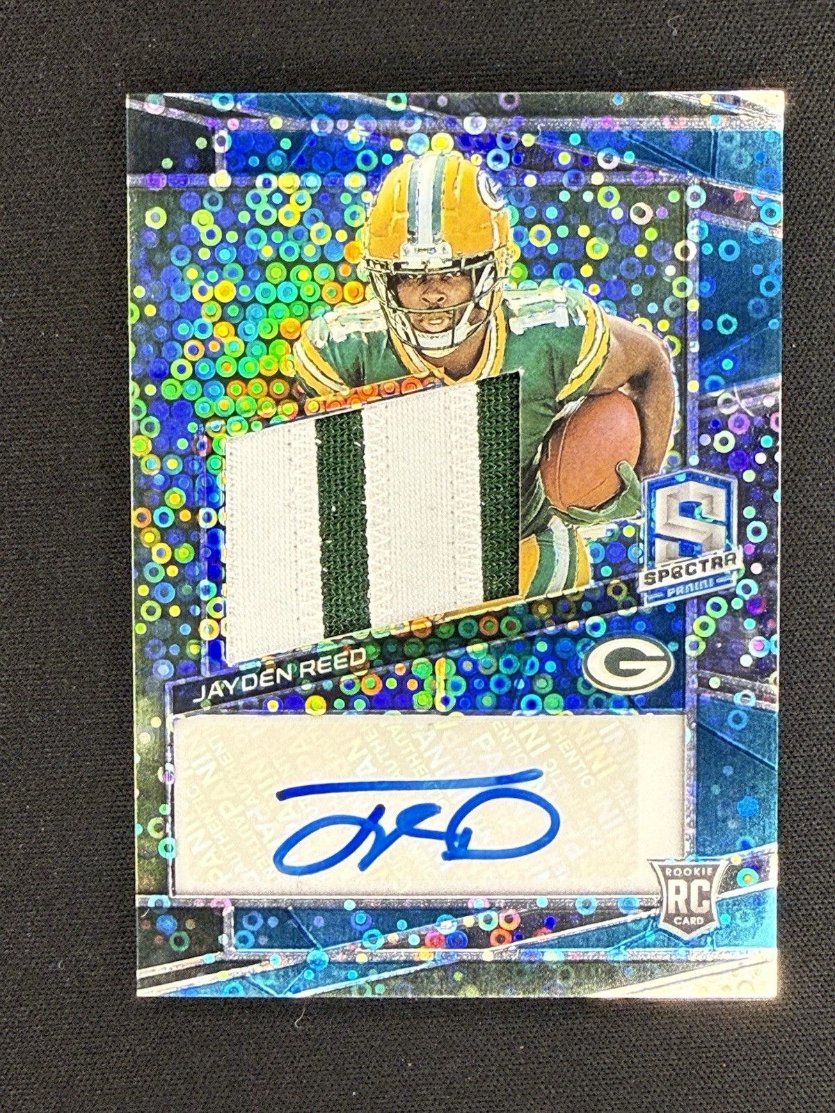 2023 Panini Spectra - Rookie Patch Auto Jayden Reed #218 Neon Blue Prizm /50 RC