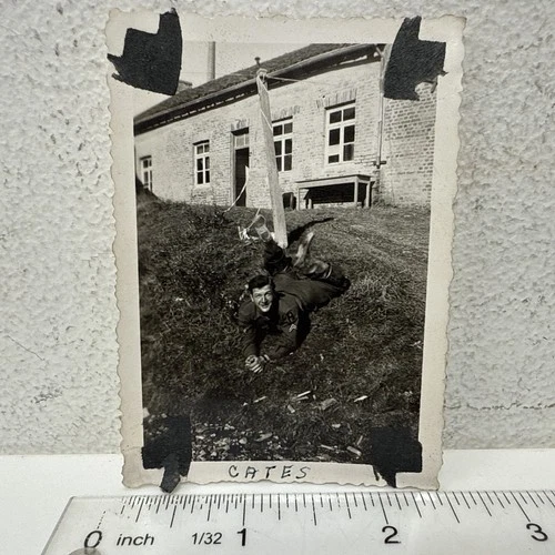 Vintage Snapshot Photo US Military Soldier Silly Goofy Pose Feet in Air WWII