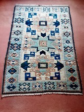 A Turkish Woollen Rug of Caucasian/Kelim Design. 202cms x 137cms.