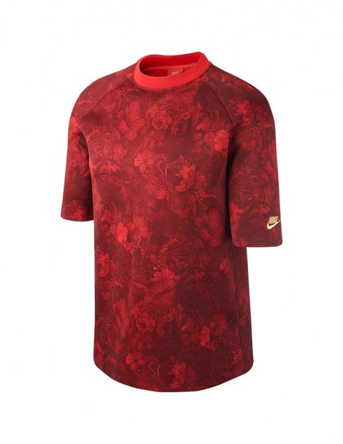 red gold nike shirt