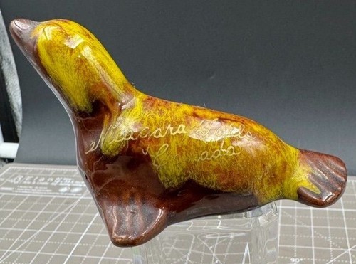 Vintage Niagara Falls Canada Ceramic Seal Figurine Brown & Yellow