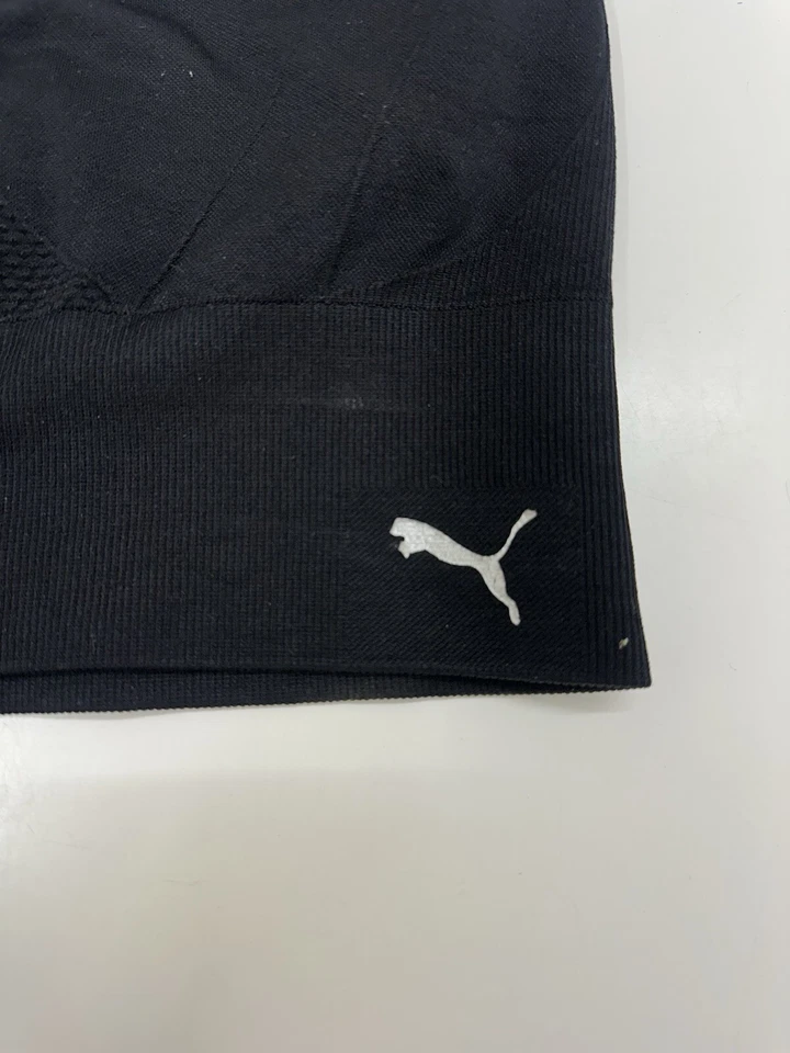 Sujetador deportivo Puma para mujer talla mediana negro sin costuras con tiras espalda deportiva sin relleno Foto 2 de 4