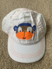 BNWOT Next Peaked Baseball Cap/ Sun Hat. Unisex. Age 6 - 12 Months. White Monkey