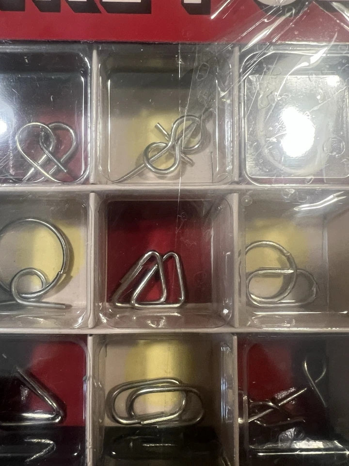 12 PUZZLES DE ALAMBRE Schylling rompecabezas juegos mentales juguete rompecabezas de alambre de acero Foto 3 de 4