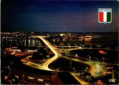 VINTAGE CONTINENTAL SIZE POSTCARD NIGHT IN ABIDJAN IVORY COAST