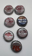 Lot of 7 Vintage 1985 Cherry Coca Cola Bottle Caps. Dr Pepper, Pepsi, RC