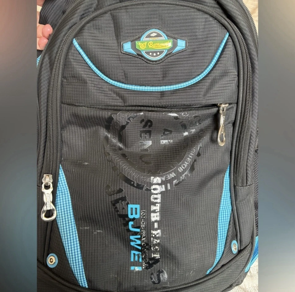 Mochila azul y gris con portabotellas de agua y varios compartimentos Foto 3 de 4