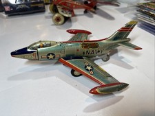 US Navy jet Japan made Vintage tin Lithograph Airplane Demon friction e.t.c.o.