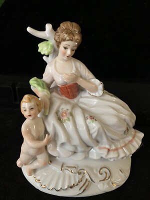 F.E.I. INC.  ceramic woman and cherub figurine Very Beautiful piece