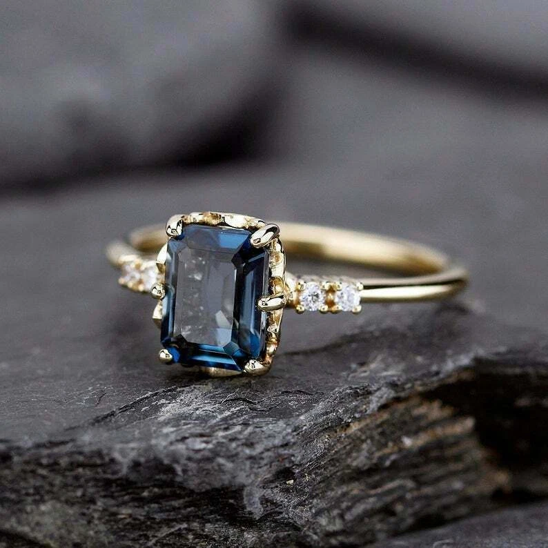 Blue diamond on sale yellow gold ring