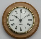 Oak Clock Suitable for Caravans, Motorhomes White Roman dial with brass bezel.