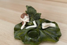 Green fairy lounging on lily pad tea light candle holder Axicon world imports vt
