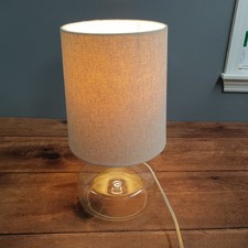 Modern Clear Glass Table Lamp with Oatmeal Linen Drum Shade Minimalist Design