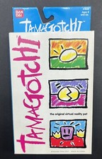 Original 1997 Tamagotchi 1800 Gold, Black Buttons, Original Box-Unopened