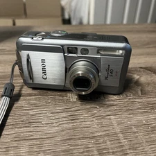 Canon PowerShot S40 Digital Camera No Charger Or Battery. Working please READ