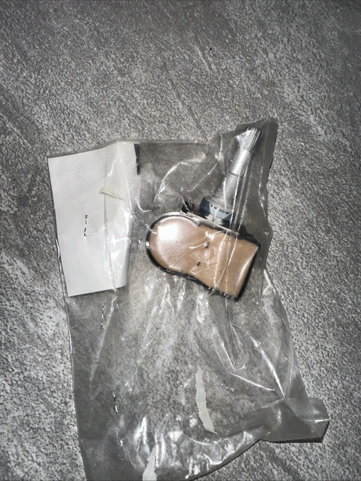 Sensor de presión de neumáticos genuino Mazda TPMS BHA4-37-140A OEM Foto 2 de 2