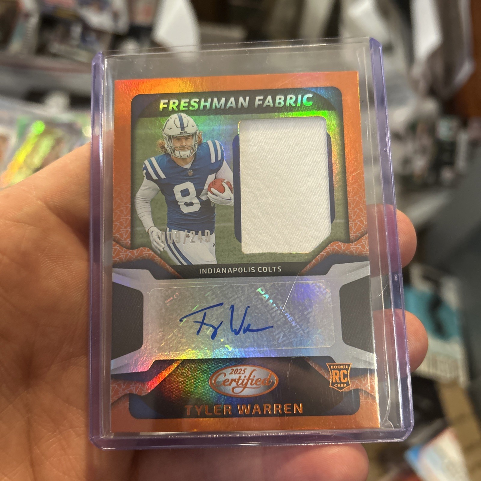 2025 Panini Certified Freshman Fabric Tyler Warren Orange Rookie Patch Auto /249